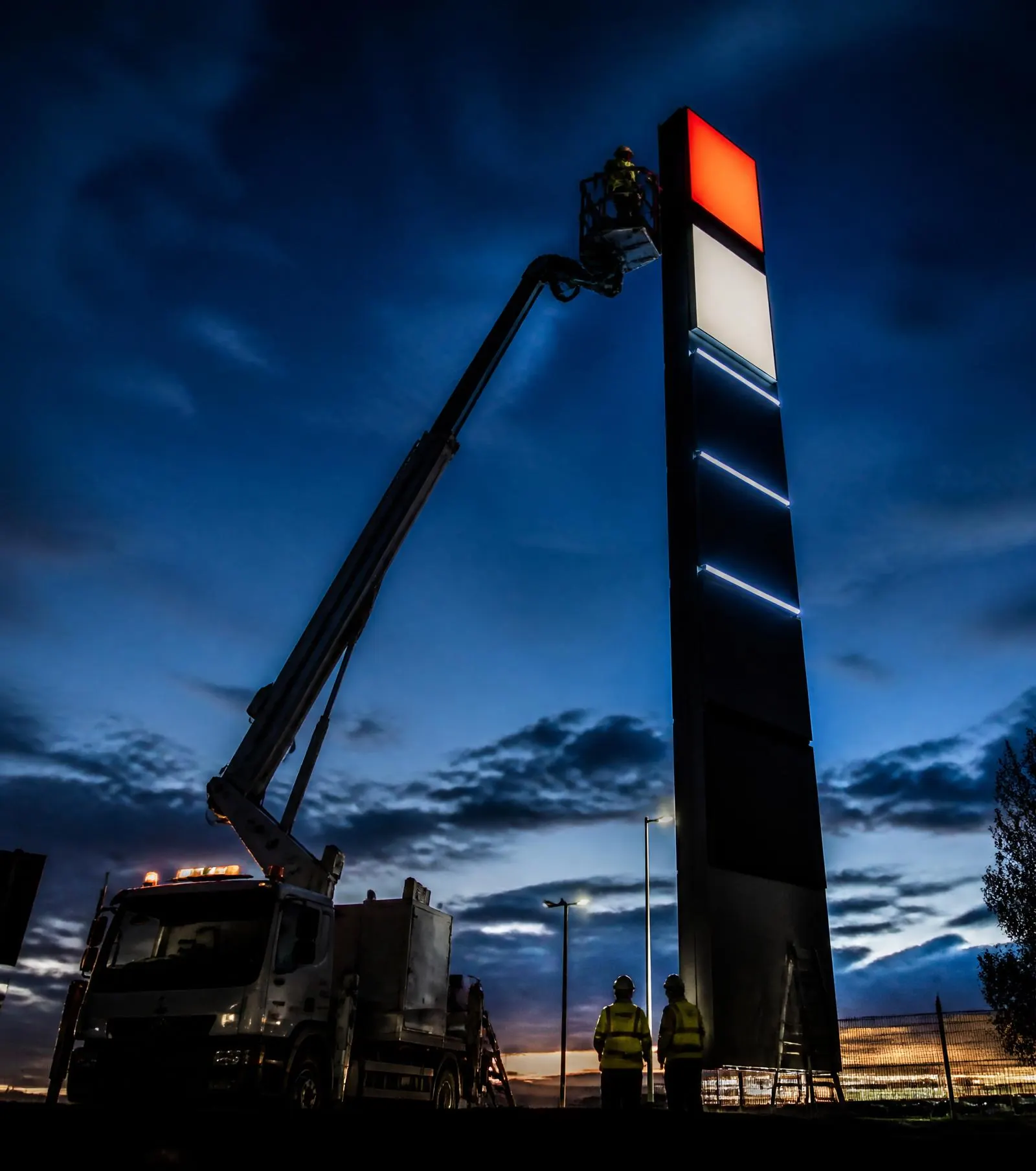 Sign installation crew with permit-required equipment